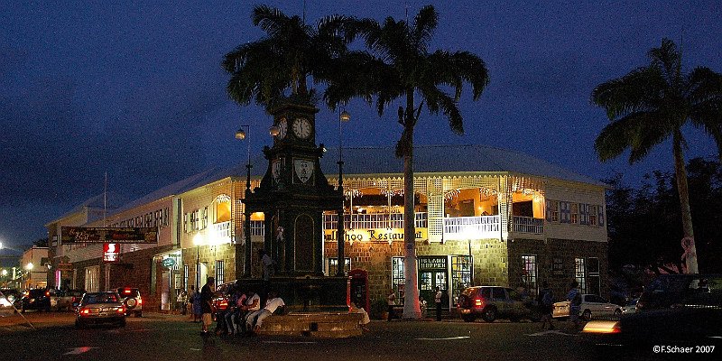 Horizonte 218.jpg - "the Circus" in Basseterre (Capital of St. KItts and Nevis inthe eastern Caribbean) just before midnight. We enjoyed sitting in the upperfloor of the "Ballahoo" Restaurant for dinner and overlook the traffic and thefolks around the clocktower.   click here for Google Maps View   Position: S17°17'43"/W62°43'25" (wrong !), elev. 10m/30ft above sealevel Camera: Nikon D50, zoom at 26mm, date: 16/11/2007 11:29pm local time